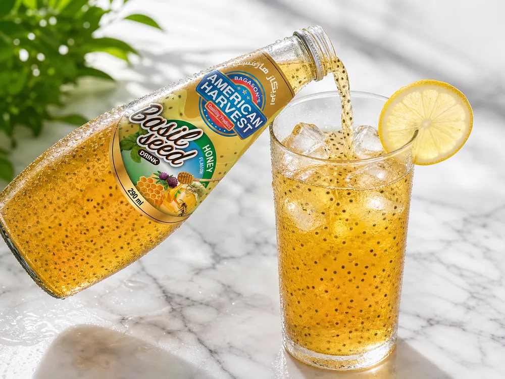 Basil seed mango drink poured over ice
