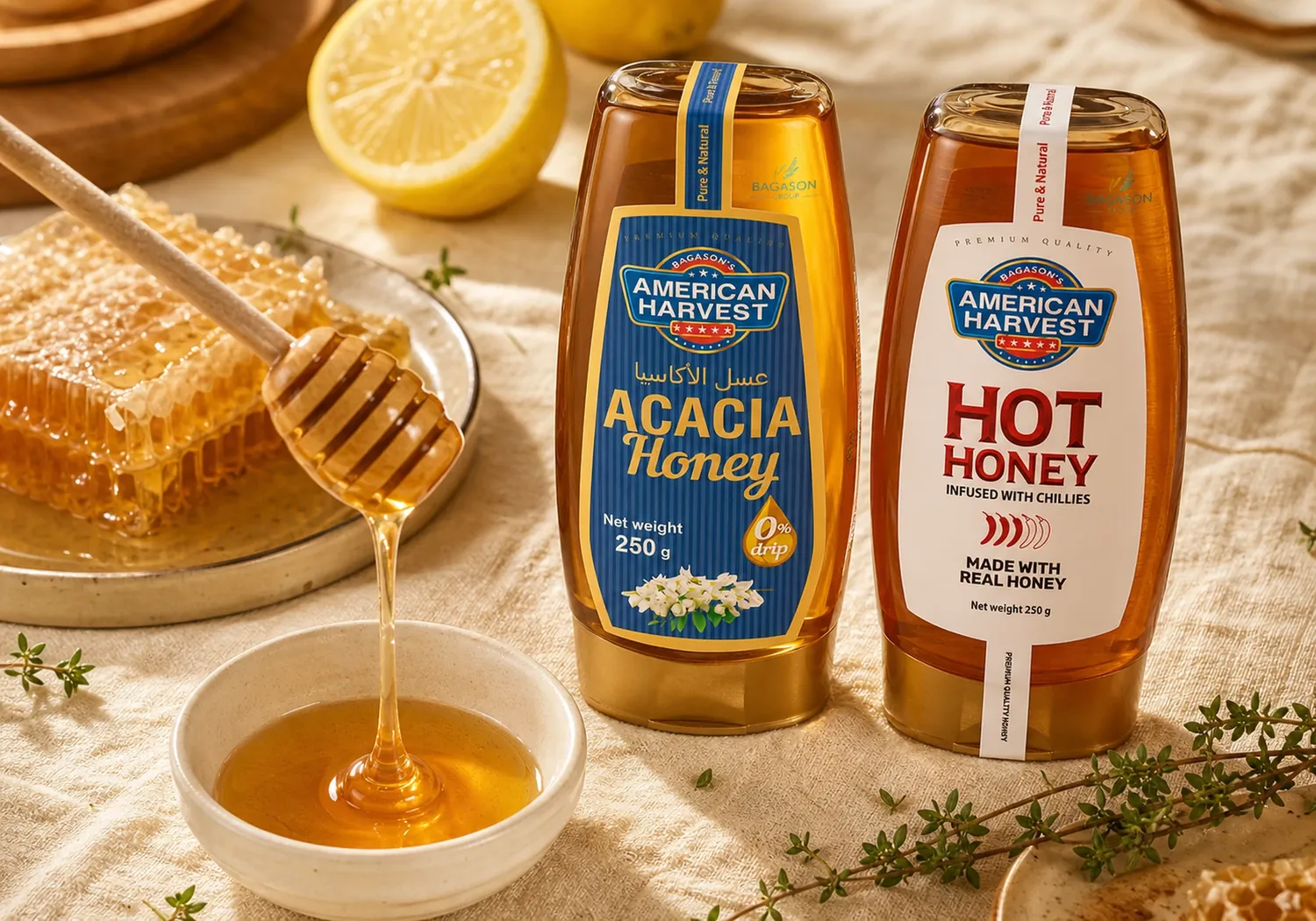 American Harvest Acacia Honey and Hot Honey squeeze jars with honeycomb, lemon and honey pour on cream linen