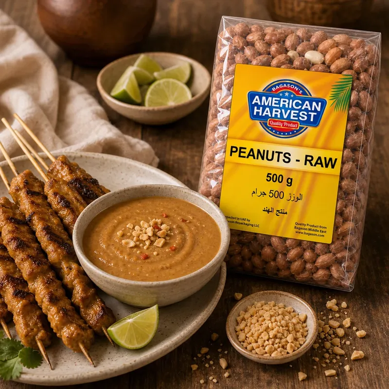 Bowl of peanut satay sauce with skewers